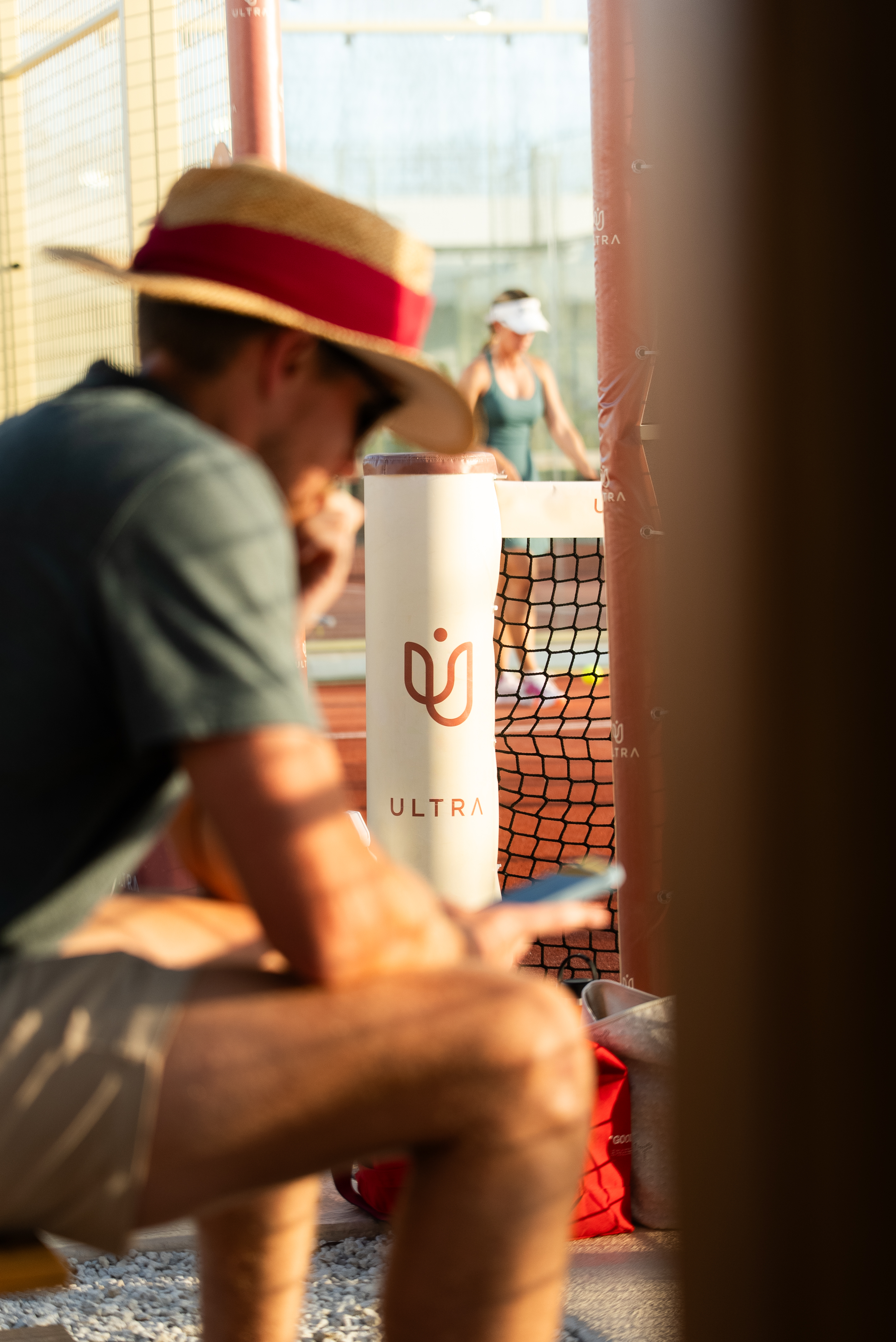 Members courtside at golden hour at Ultra Padel Miami